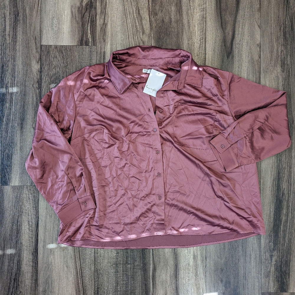 Long sleeved Collared Button Up, silky material with a pocket